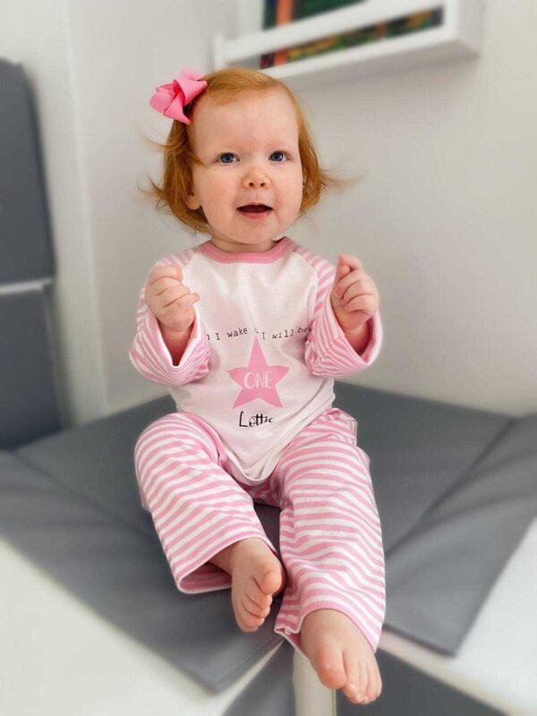 Baby wearing Personalised birthday pyjamas